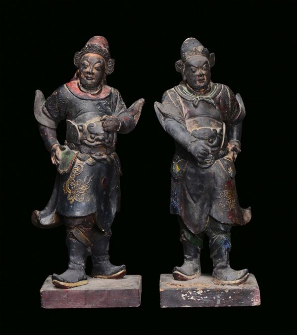 A pair of large black lacquered earthenware Dignitaries, China, Ming Dynasty, 17th century