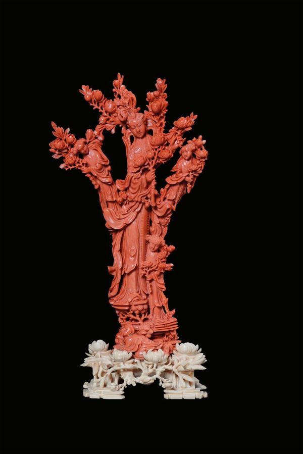 A red coral 'four Guanyin with blooming branches’ group, China, Qing Dynasty, 19th century