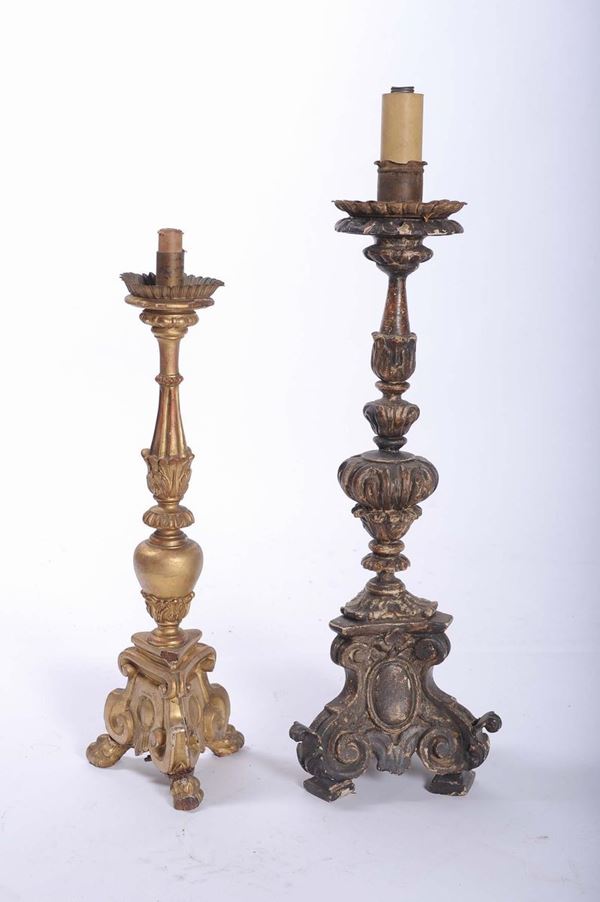 Due candelieri differenti in legno intagliato, XIX secolo