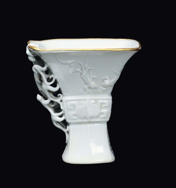 A small white porcelain vase and gold rim, China, Qing Dynasty, Qianlong Period (1736-1795)Handles in the shape of dragons 