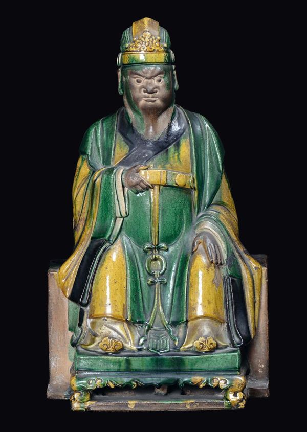 A large enamelled stoneware sitting Dignitary figure, China, Ming Dynasty, 17th century