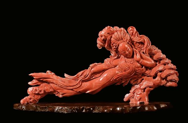 A carved coral figure of lying Guanyin, China, Qing Dynasty, late 19th century,