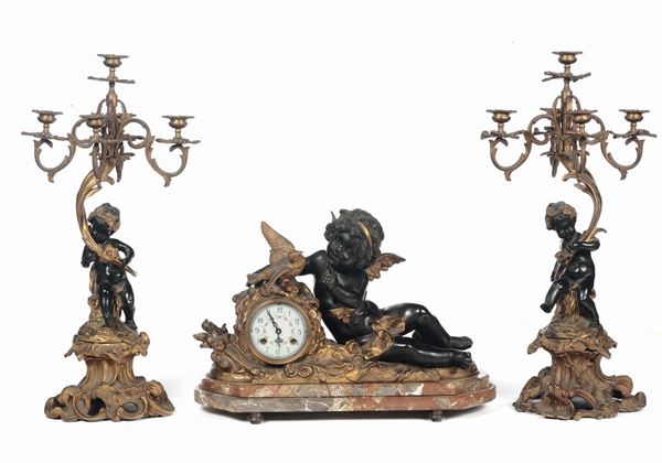Trittico composto da orologio e coppia di candelieri, Francia XIX secolo