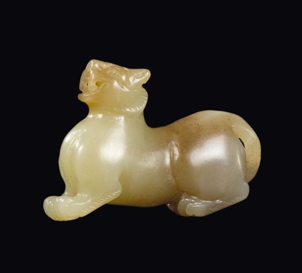 A small white and russet jade carving of a tiger, China, Qing Dynasty, 19th century
