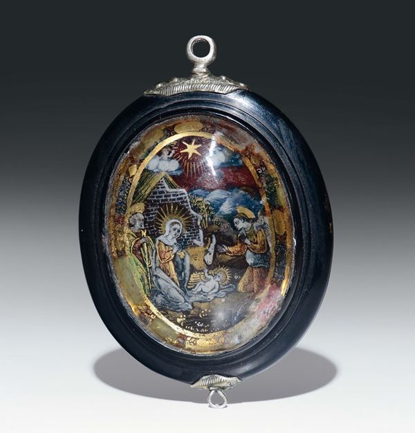 Medaglione ovale con cornice in bosso e finimenti in argento. Italia o Spagna XVI-XVII secolo