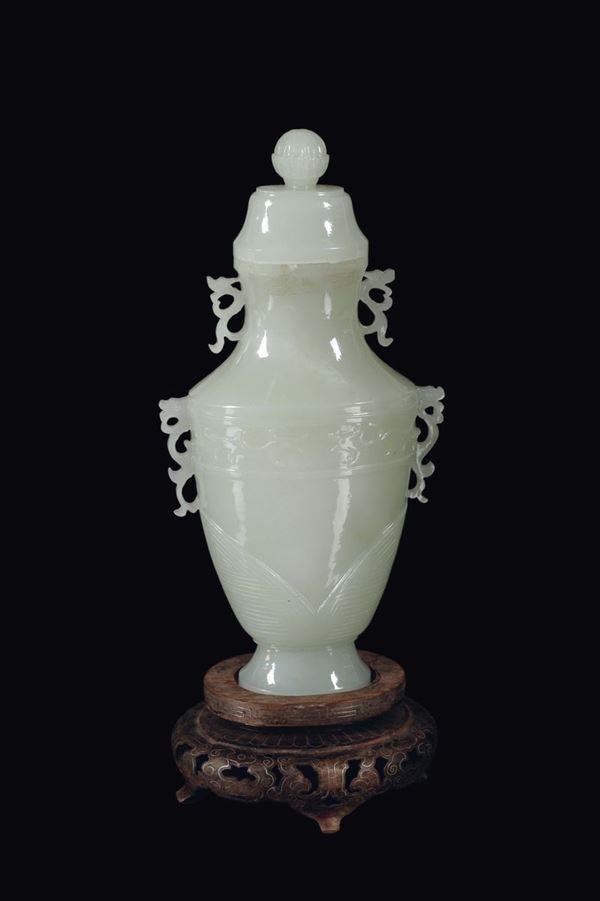 A Celadon jade double handles vase and cover, China, Qing Dynasty, 19th century