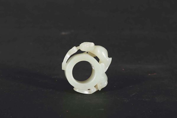 A white jade archer ring with animal in relief, China, Qing Dynasty, 19th century