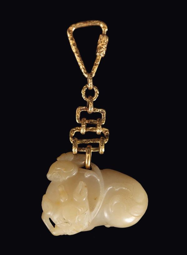 A white jade carving of Pho Dog with gilt key chain, China, Qing Dynasty, 18th century