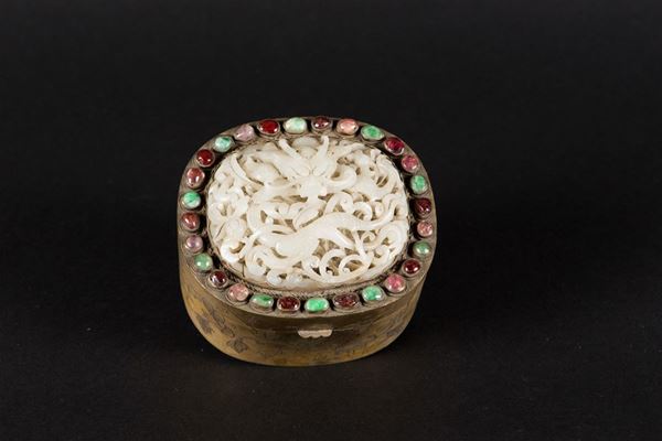 A gilt metal box with a white jade dragon plaque on the cover and hardstone inlays, China, Yuan Dynasty (1279-1368)