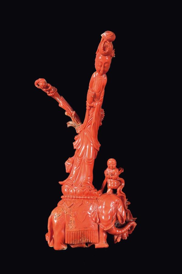 A carved coral Guanyin on elephant and children group, China, Qing Dynasty, late 19th century