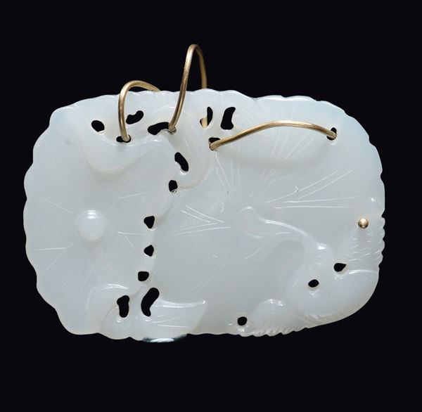 A white jade lotus flower pendant, China, Qing Dynasty, 19th century
