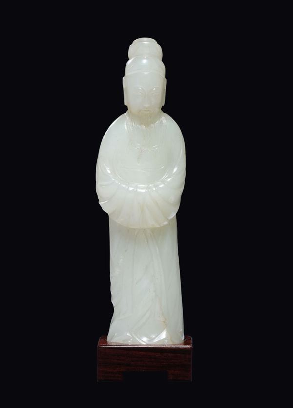 A white jade figure of dignitary, China, Qing Dynasty, 18th century