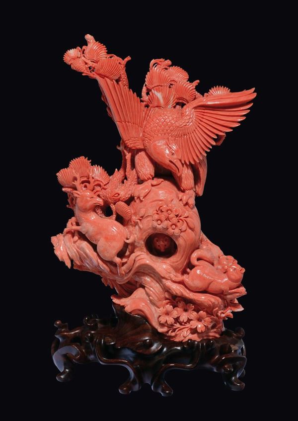 A large carved coral group with wild beast, a deer and an eagle, China, early 20th century