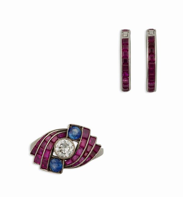 A parure composed by ruby, sapphire and diamond pair of earrings and a ring