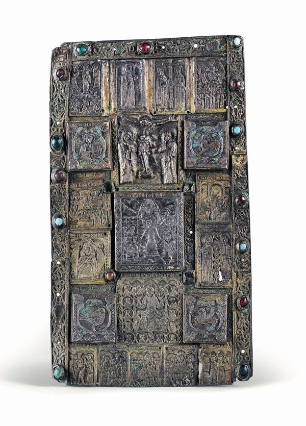 A bronze bible cover with semiprecious stones