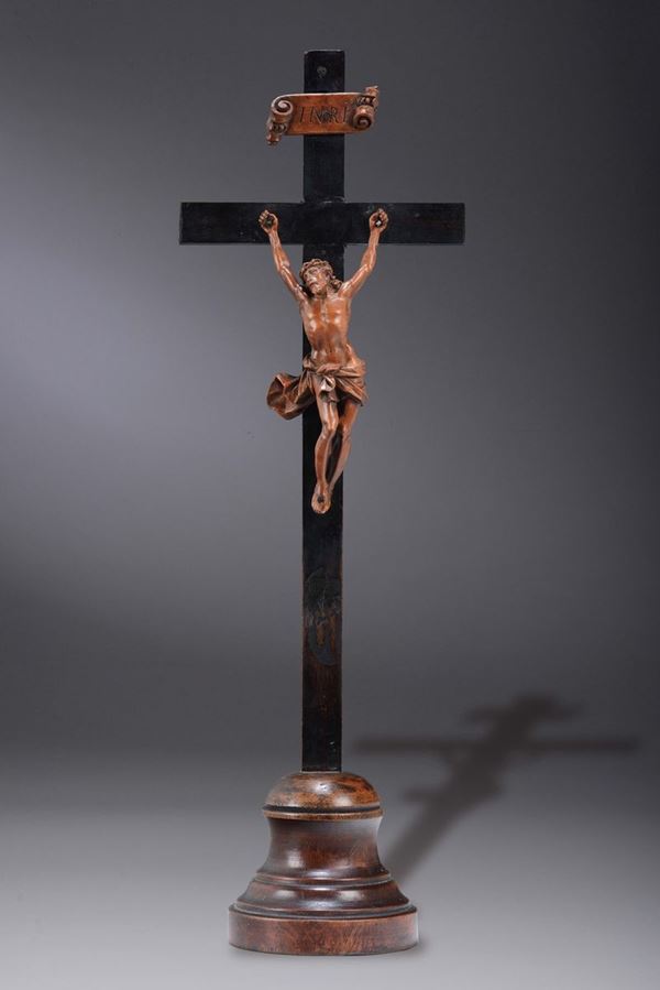 A boxwood figure of Christ and an ebonised pearwood crucifix. Baroque sculptor from northern Italy or from over the Alps active during the 18th century