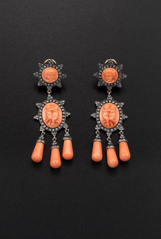 A pair of coral, diamond, gold and silver pendent earrings. Puttini Capri