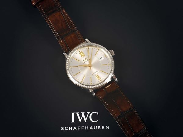 IWC, Schaffausen, Automatic, PORTOFINO, stainless steel and diamonds, self-winding wristwatch with date and an original buckle. Accompanied by the original box and Guarantee.