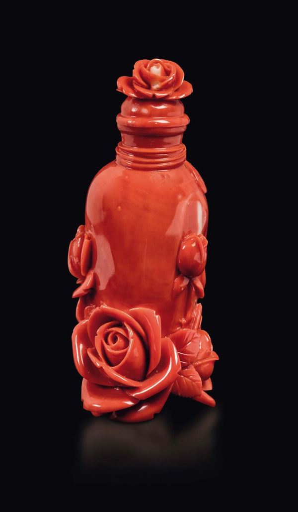 A carved coral vase and cover with roses in relief, China, early 20th century