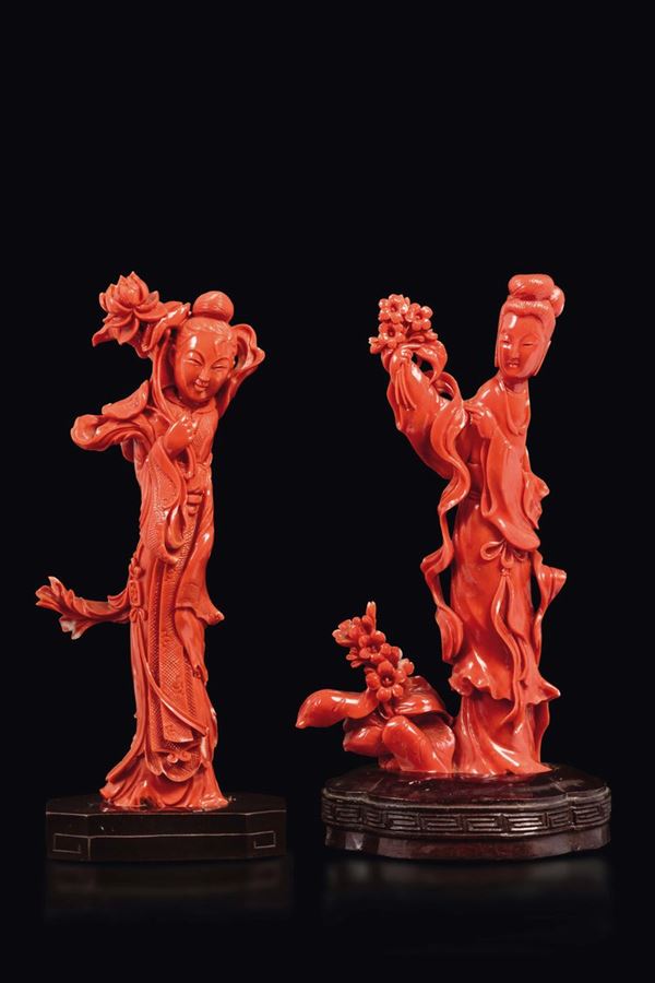 Two carved coral figures of Guanyin with flowers, China, early 20th century