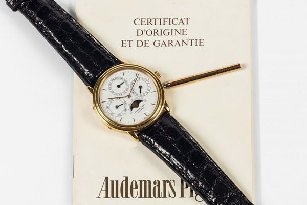 AUDEMARS PIGUET, Genève, Quantieme Perpetuel Automatique, YELLOW GOLD,  movement No. 273918, Ref. Made in the 1980s. Very fine, astronomic, self-winding, 18K yellow gold wristwatch with perpetual calendar, moon phases and an integral 18K yellow gold Audemars Piguet buckle. Accompanied by the original box, Guarantee, booklets, push pin and additional original strap.