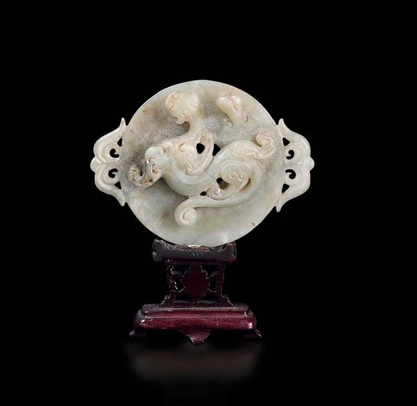 A carved jade Bi with small dragon in relief, China, Qing Dynasty, 18th century