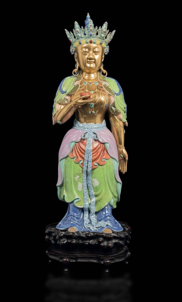 A large polychrome enamelled porcelain figure of crowned Guanyin with a cup, China, Qing Dynasty, Qianlong  [..]