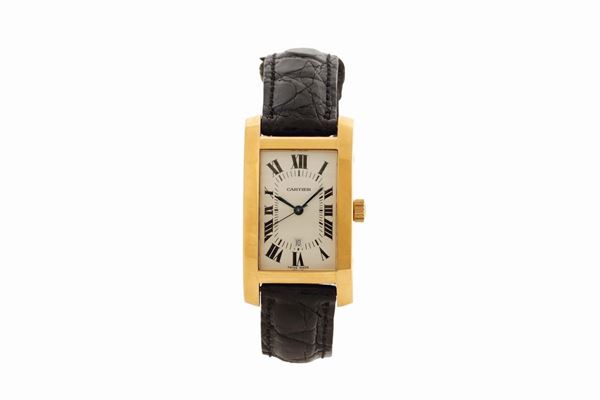 CARTIER, TANK AMERICAINE, YELLOW GOLD, case No. 8172984. Made circa 2000. Fine, rectangular curved, center seconds, self-winding, water- resistant, 18K yellow gold wristwatch with date and an 18K yellow gold Cartier buckle. Accompanied by the original box