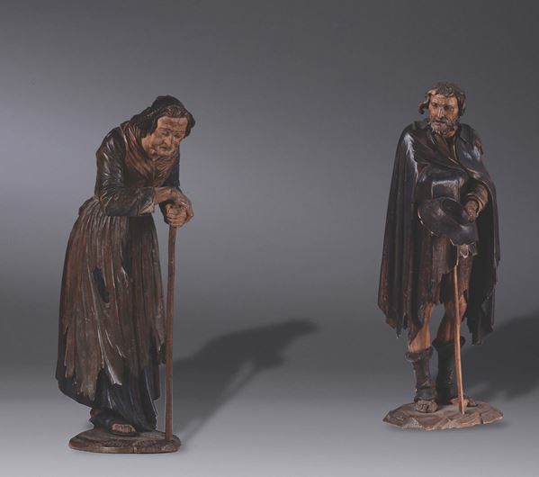 A pair of wooden sculptures with beggars, Germany or Austria, 19th century