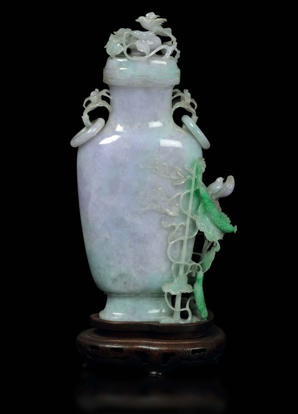 An apple green shades jadeite vase and cover with ring handles birds and leaves in relief, China, early  [..]