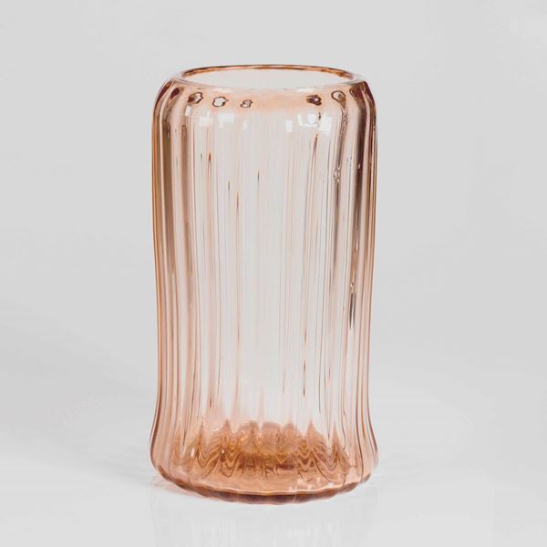 Venini, Murano, 1945 ca. A large rose-coloured ribbed vase in heavy glass.