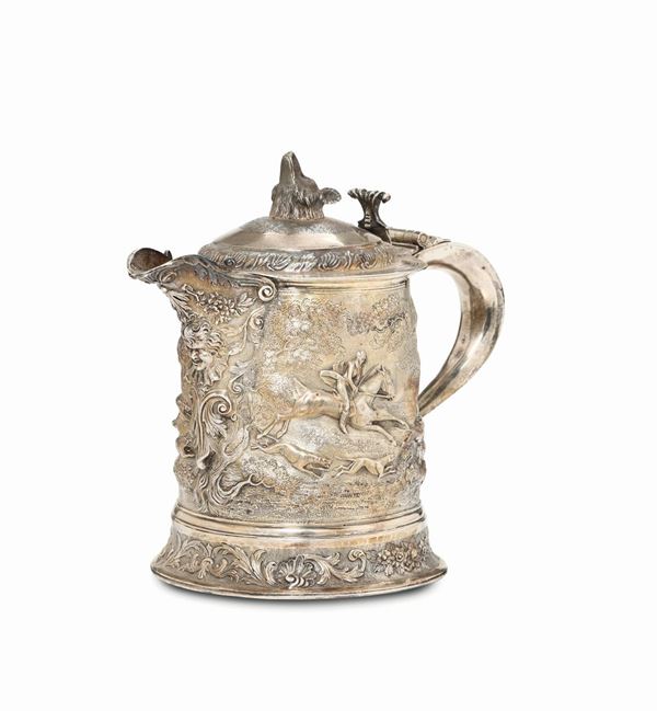 A large Tankard in molten, embossed, chiselled and gilded silver, England 19-20th century (marks are hardly readable)