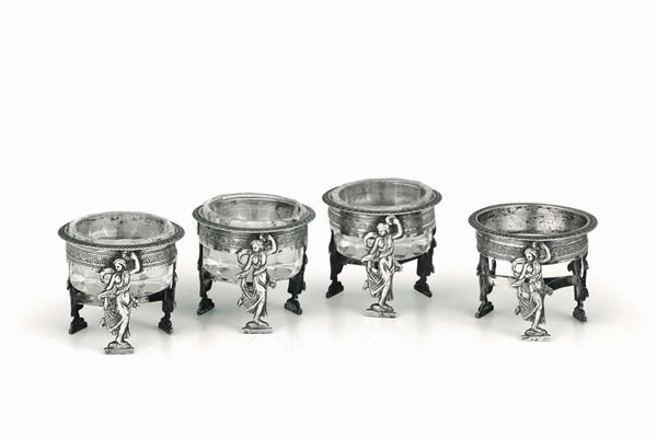 Four salt cellars in molten and chiselled silver, Genova, half of the 19th century, unidentified mark.