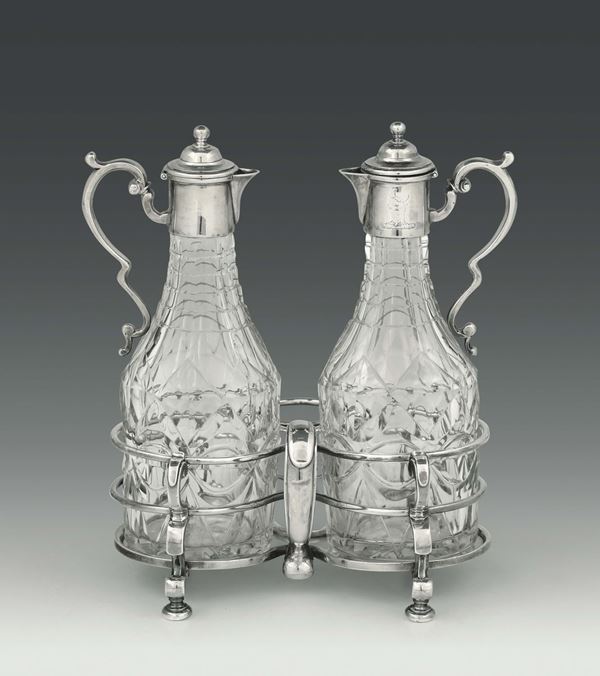 A cruet stand in molten, embossed and chiselled silver with two glasses, London 1713, silversmith Pierre Platel (?)