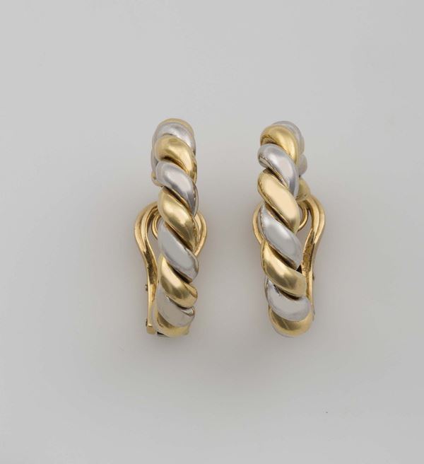Pair of gold earrings. Cartier