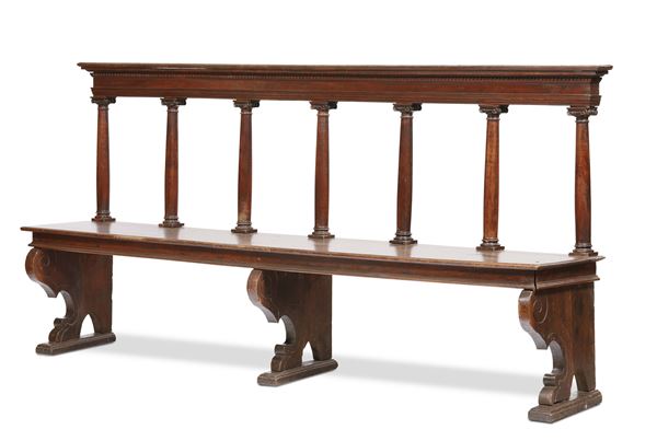 A Renaissance-age bench on an architectural model, walnut, Tuscany 16th century