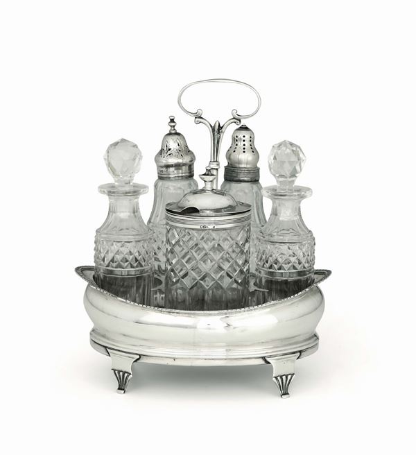 A cruet in molten, embossed and chiselled silver. Containers in ground glass. London 1810?