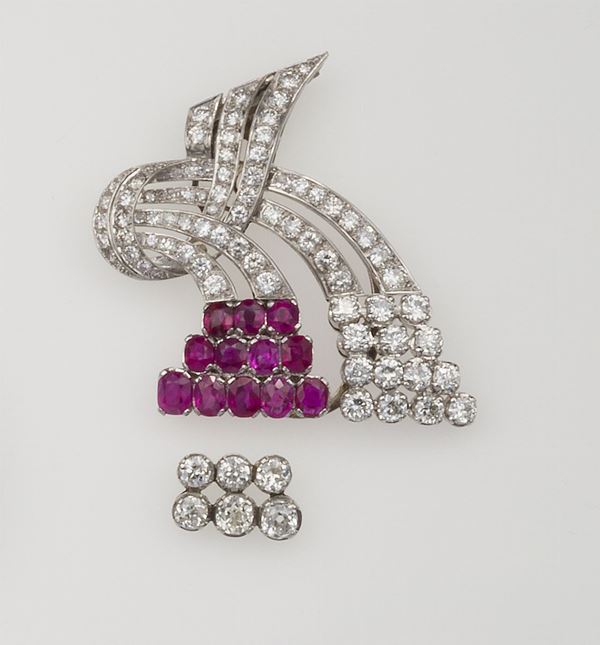 Platinum clip with Burmese rubies and old cut diamonds. The ruby insert can be alternated with a diamond one.