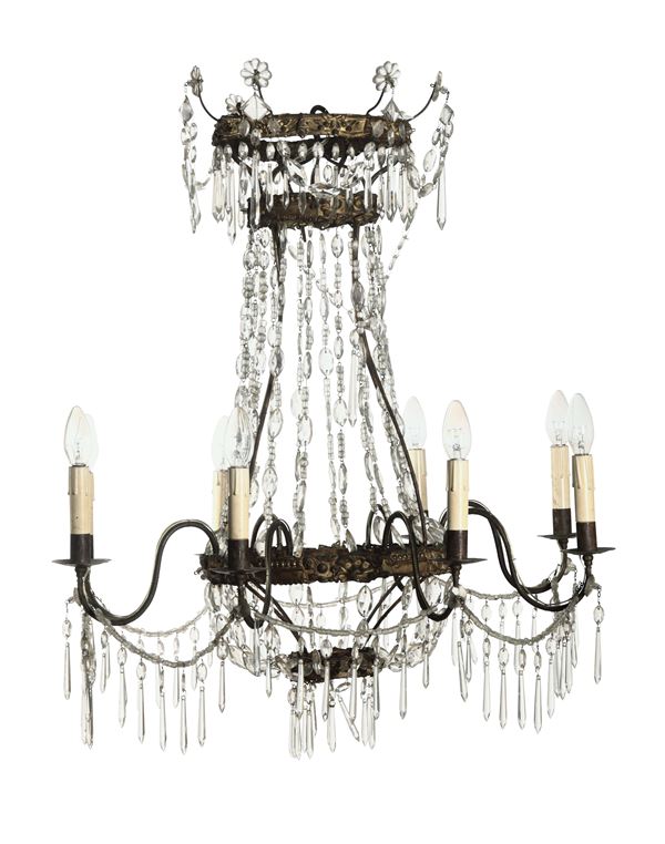 A pair of eight-armed chandeliers in gilded bronze and crystals, 19th century