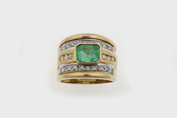 Anello a fascia con smeraldo centrale di ct 1,80 circa e diamanti taglio brillante