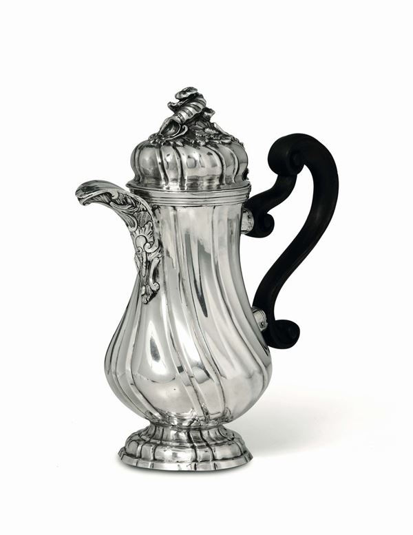 A coffee pot in molten, embossed and chiselled silver and wood. Cagliari, second half of the 18th century,  [..]