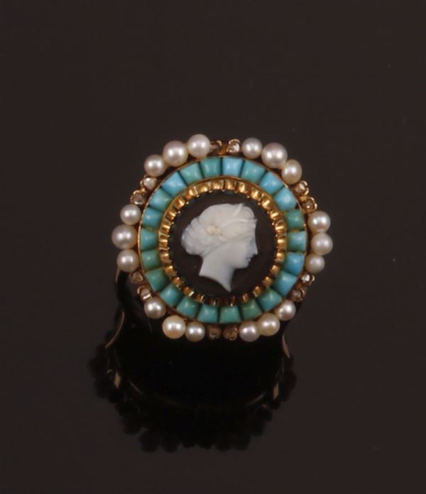 Ring with a chalcedony cameo and turquoise, pearl and rose diamond surround, in 750 yellow gold. A late 19th century brooch mounted as a ring in the early 20th century.