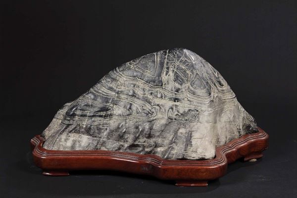 A Gongshi stone with wooden base, China, 19th century
