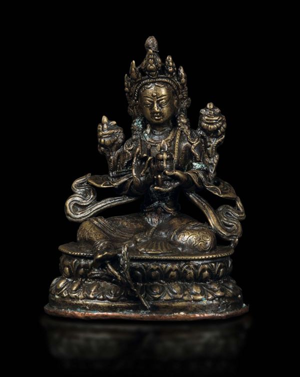 Figura di Avalokitesvara seduta su doppio fiore di loto in bronzo, Tibet/Nepal, XV secolo