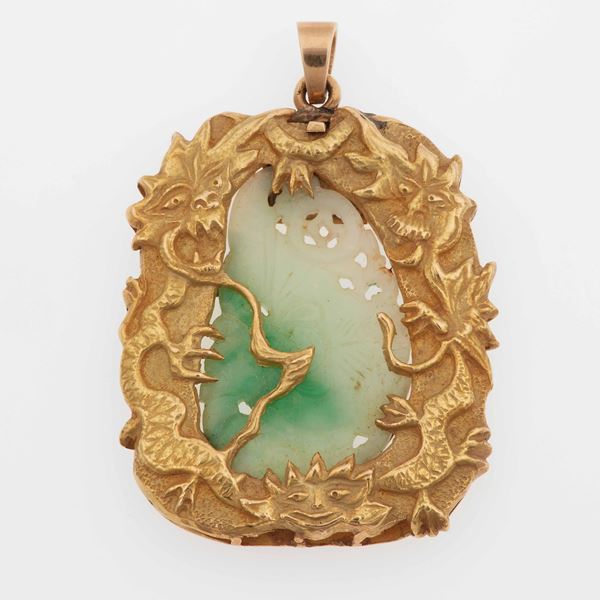 Carved jada and gold pendant