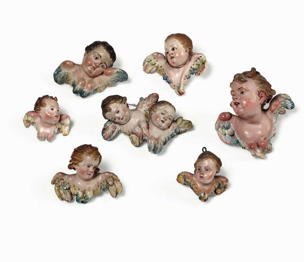 Gruppo di sette teste di angeli da presepe. Napoli XIX secolo