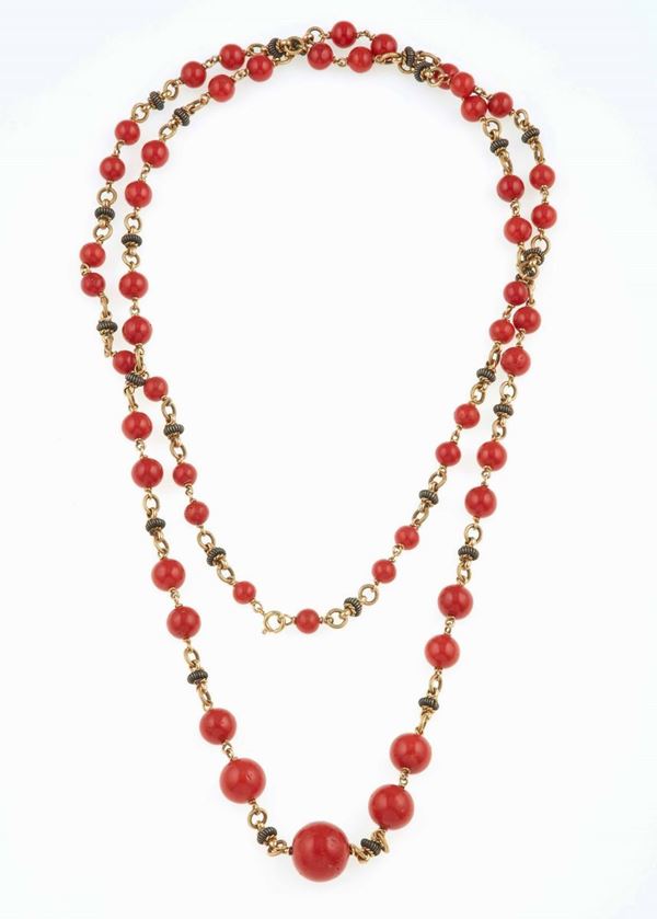 Coral and gold necklace and a pair of earrings