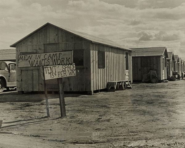 Dorothea Lange (1895-1965) Men in camp wants work