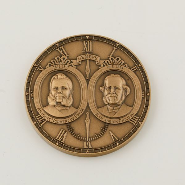 PATEK PHILIPPE - Medaglia in bronzo commemorativa del 150° anniversario della Maison accompagnata da astuccio originale