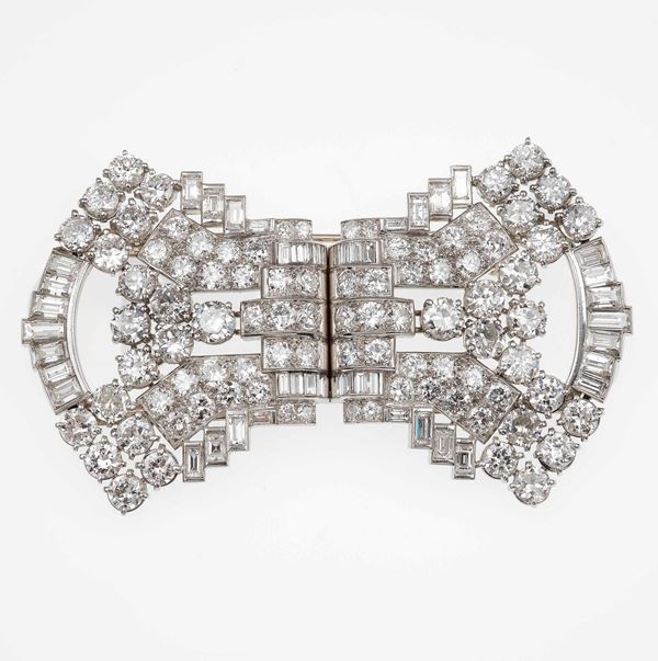 Platinum and diamond double-clip brooch. Signed and numbered Mauboussin-Paris 8192 and bearing French  [..]